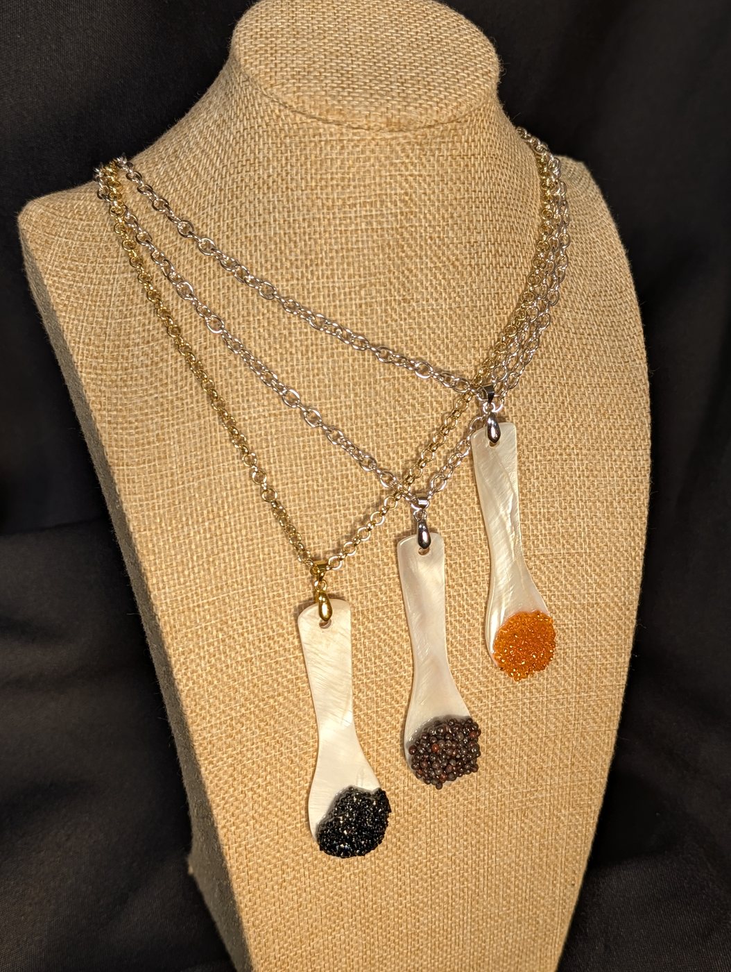 Trio on mixed gold and steel chains