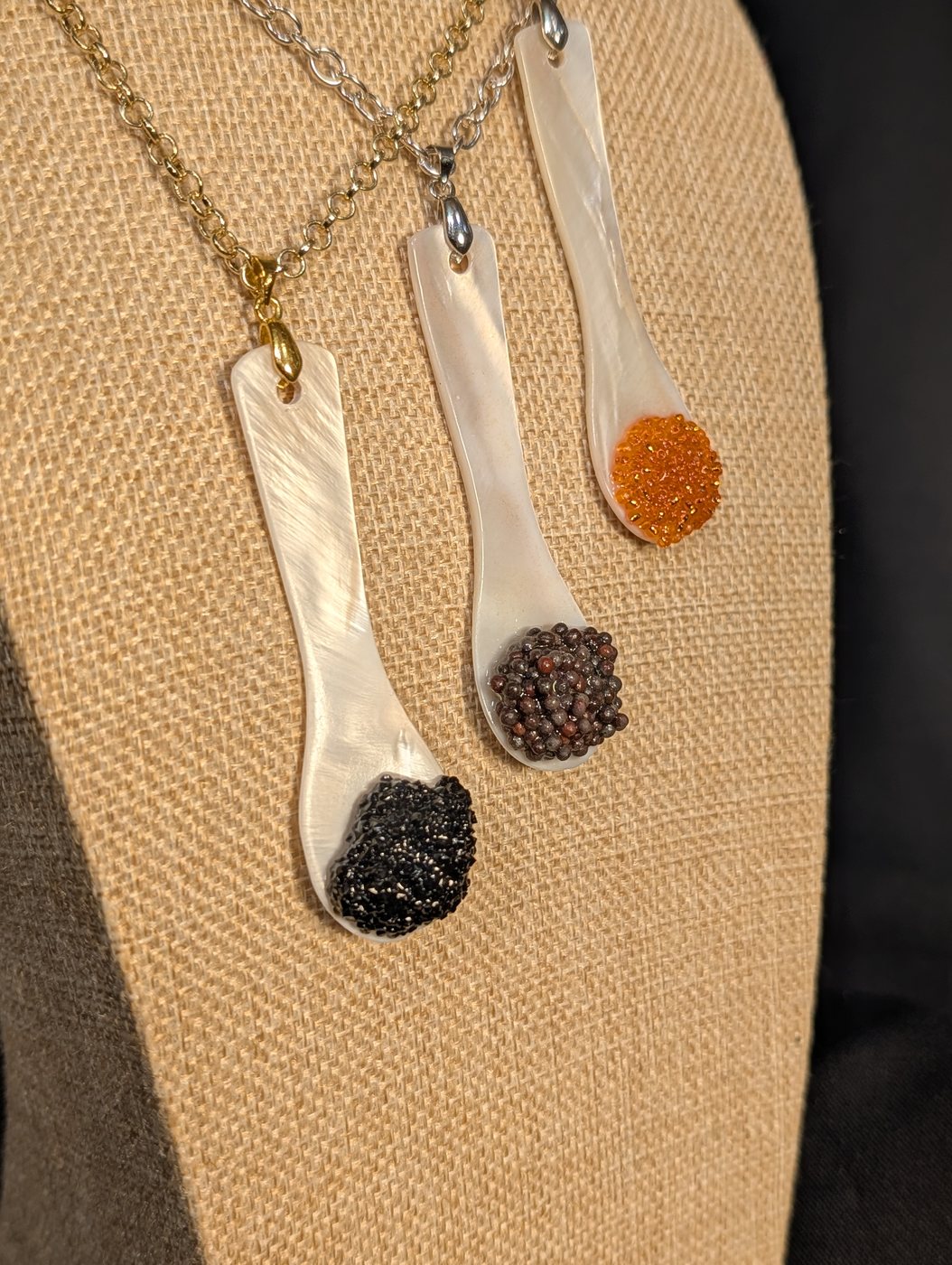 Black, brown and salmon bowls side by side